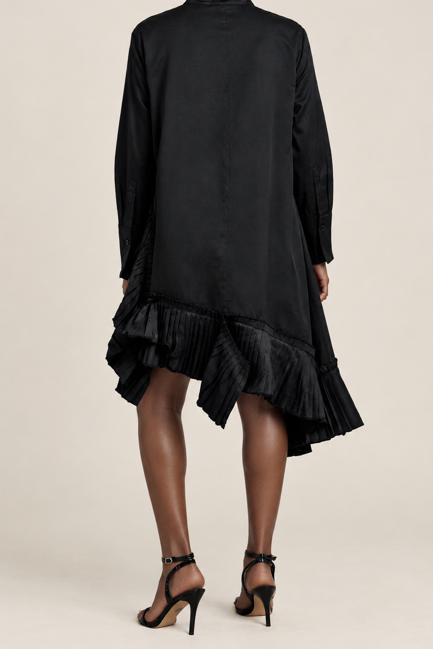 A woman shown from the back wearing a black long-sleeve high-neck dress with a ruffled hem