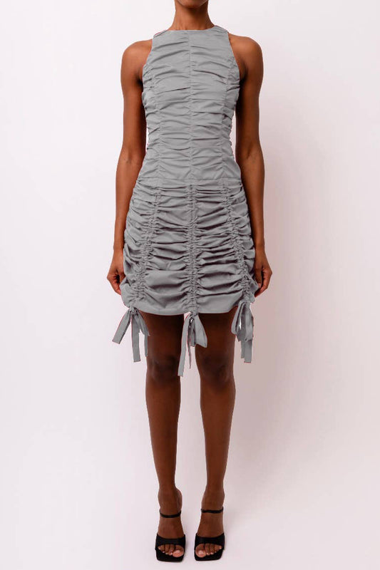 High-neck mini dress with ruche fabric detail and an adjustable ruched skirt and ruffle bow ties.

Adjustable ruched skirt.

Ruffle bow ties.

Rear zip fastening.