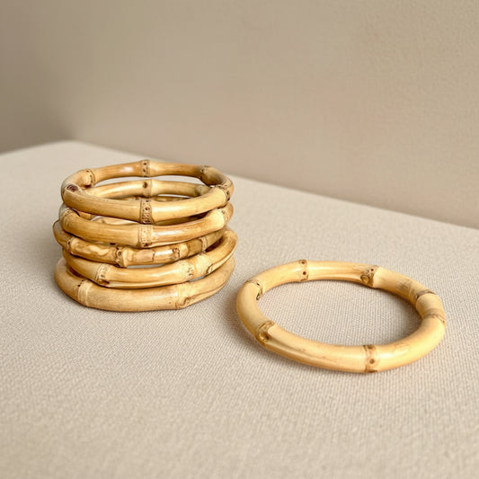 100% natural bamboo

Lightweight, minimalist

Handcrafted

Care Instructions: Keep dry and wipe with a soft cloth if needed. Avoid prolonged exposure to water, lotions, or perfumes to maintain the bamboo’s natural finish.

One Bamboo Bangle Bracelet

Material: Bamboo

Outer Diameter: 3.5 inches

Inner Dimeter: 2.5 inches

Height: .25 inches